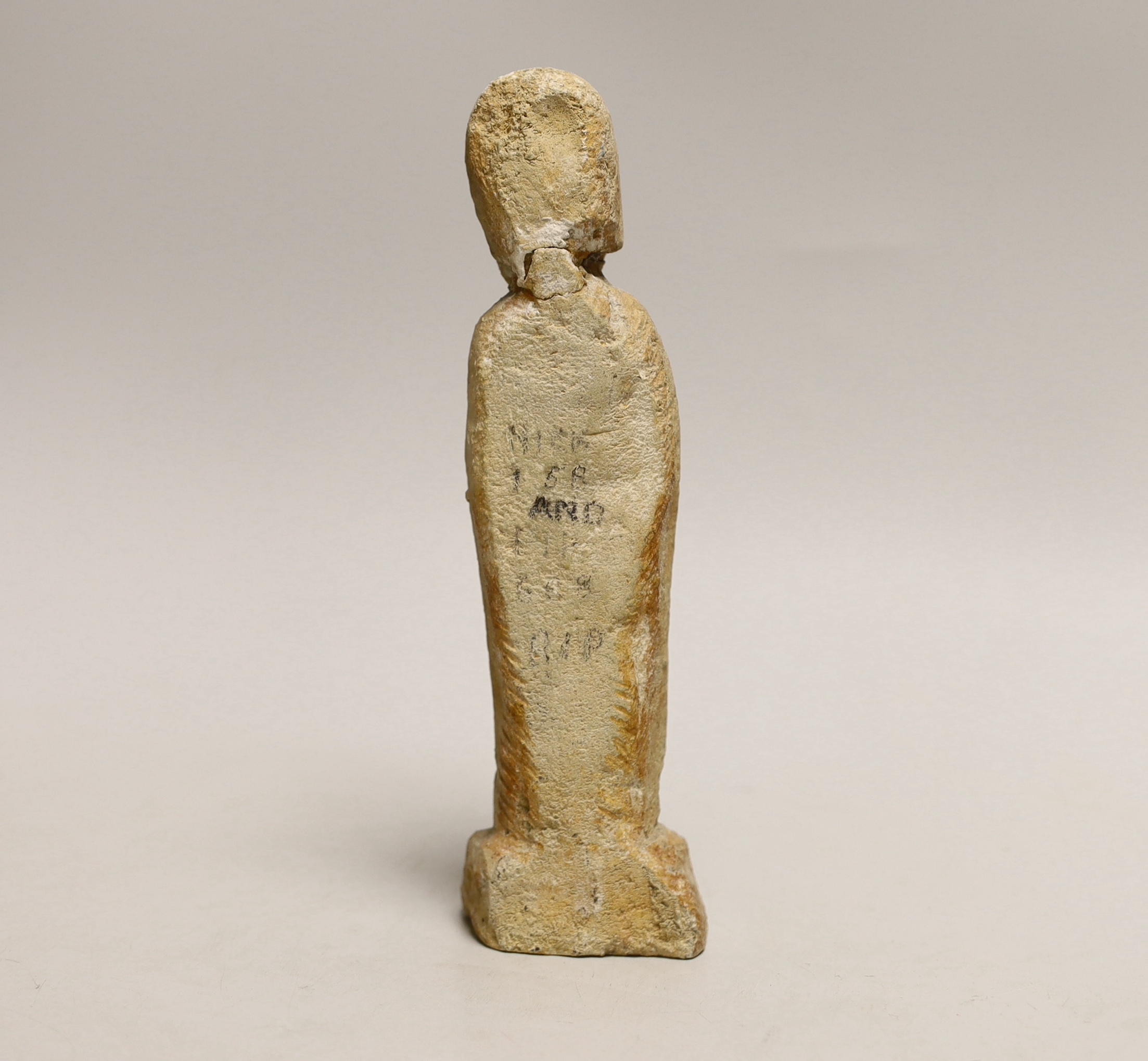 A limestone figure of Saint Peter, possibly Norman period 21cm